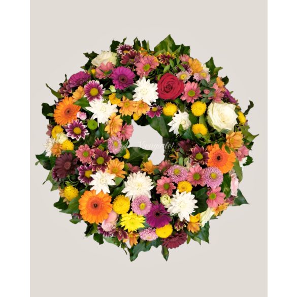 Colorful mixed flower funeral wreath